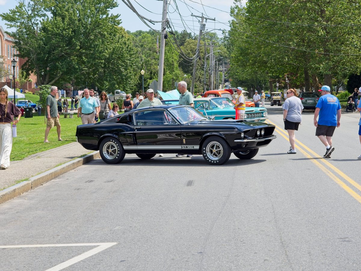 Spectators around 1967 Shelby G.T. 350 on display at 4th annual New England Summer Classic Car Show in downtown Andover Massachusetts, July 13, 2025